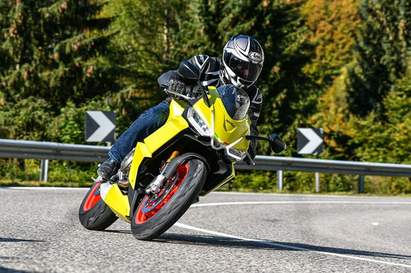 Aprilia RS660 riding up Alpine mountain road