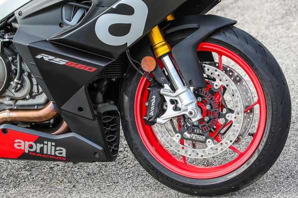 Aprilia RS660 riding up Alpine mountain road