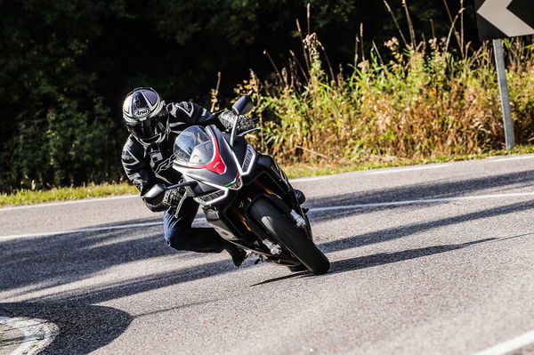 Aprilia RS660 riding up Alpine mountain road