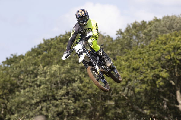 A dirt bike jumping through the air