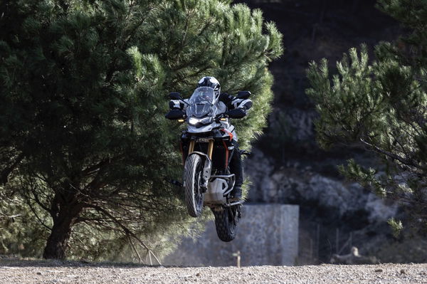 Power sliding a motorcycle on a dirt track