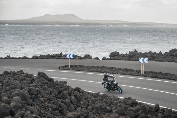 A motorcycle going around a corner