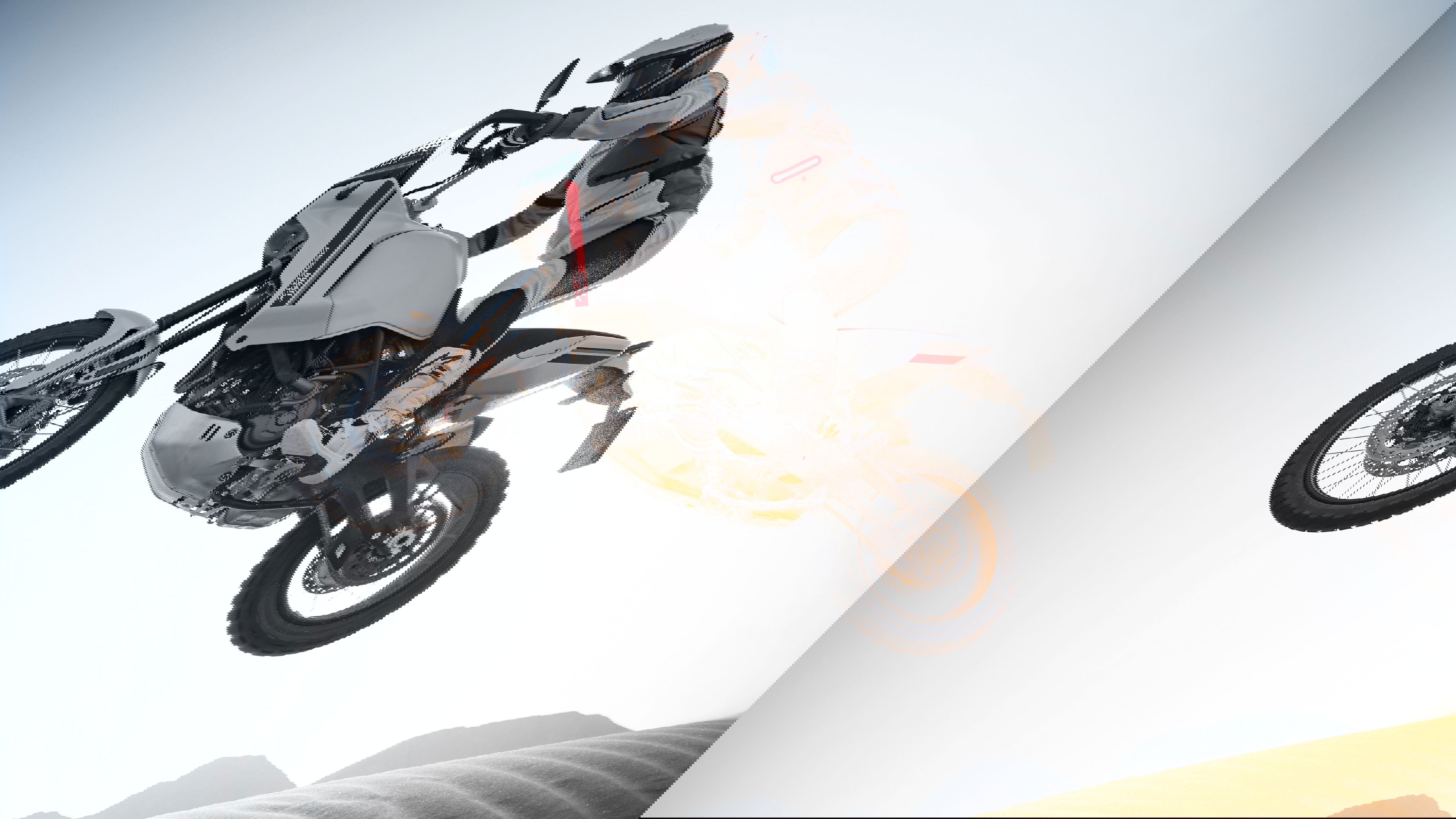 Ducati DesertX jumping through dunes