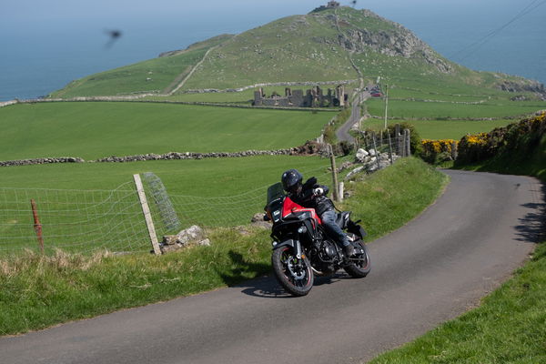 A motorbike leaving Torr Head on the Causeway Coastal Route