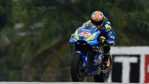 Alex Rins' MotoGP bike catches fire in the Sepang pit lane