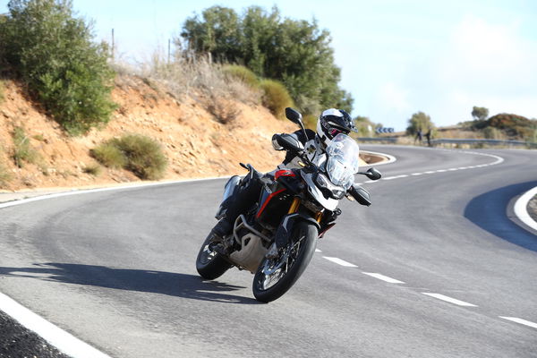 A motorcycle being ridden along a mountain road