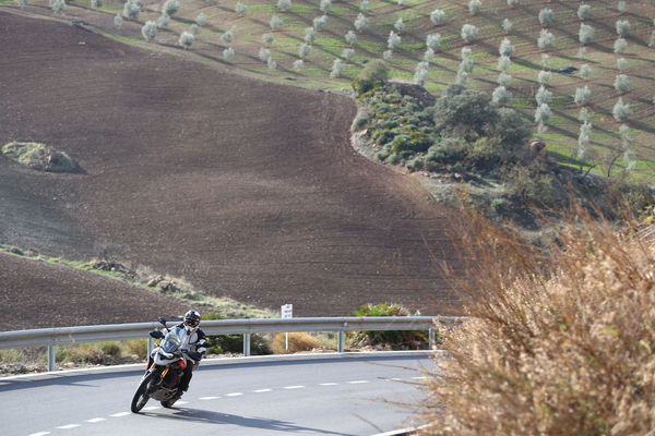 A motorcycle being ridden along a mountain road