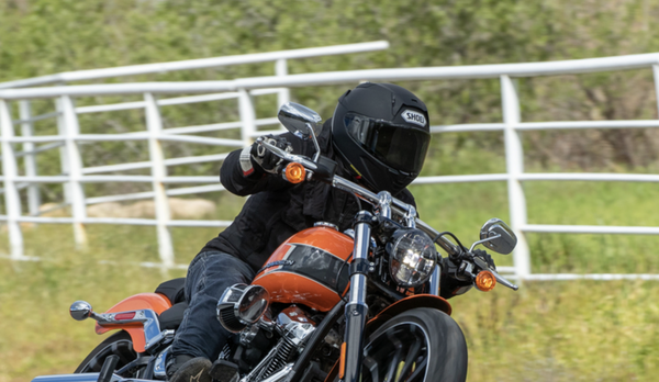 riding a motorcycle on a country road