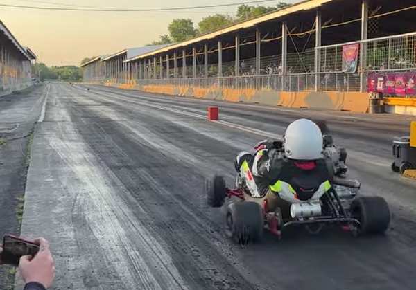 Dukarti wheelie off drag race start line. - Cars and Cameras/YouTube