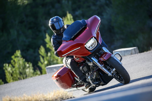 A Harley-Davidson riding along a road