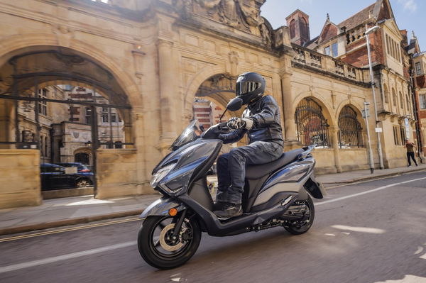 A scooter being ridden through Cambridge