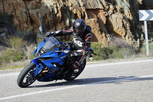 A motorcycle being ridden on a mountain road