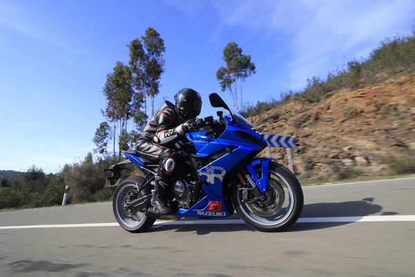 A motorcycle being ridden on a mountain road