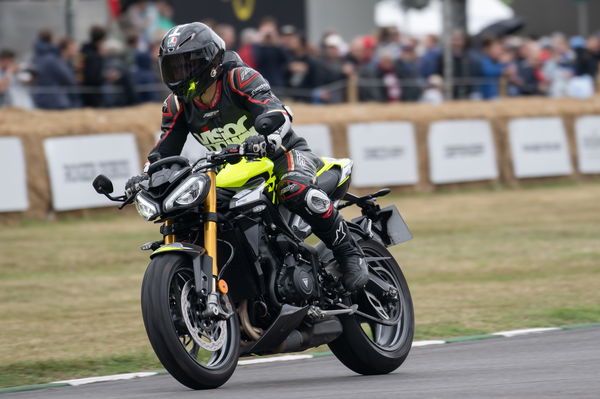 A motorcycle races up the Festival of Speed hill climb