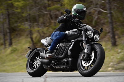 A motorcycle being ridden along a road