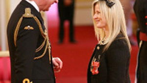 Costello takes taxibike to receive MBE
