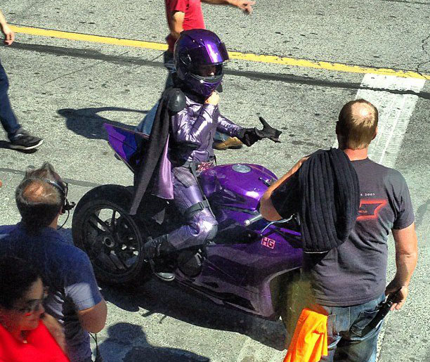Hit Girl rides a purple Panigale