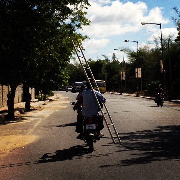 Ladder-carrying biker causes three-car smash