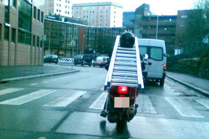 Ladder-carrying biker causes three-car smash