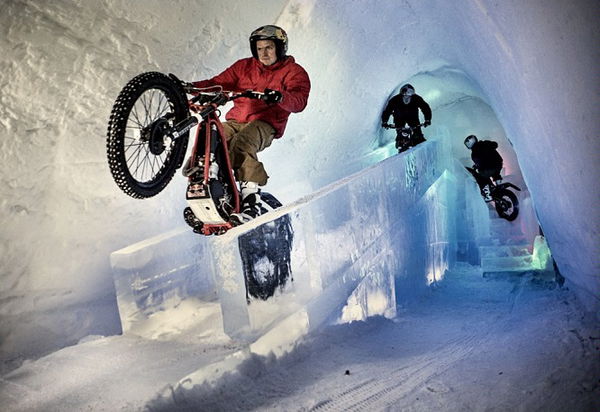 Dougie Lampkin rides through ice hotel on his trials bike