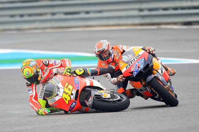 Rivals Rossi and Stoner back on track again