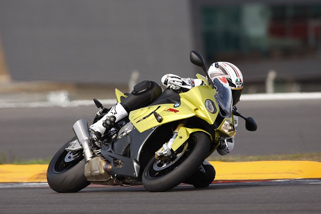 A gold BMW S1000 RR being ridden on track