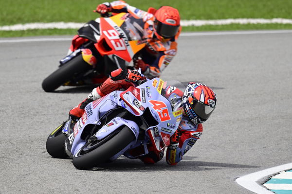 Fabio Di Giannantonio, Marc Marquez, 2023 MotoGP Malaysian Grand Prix. - Gold and Goose