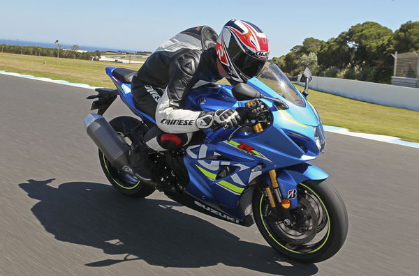 A blue 2017 Suzuki GSX-R1000R being ridden on a track