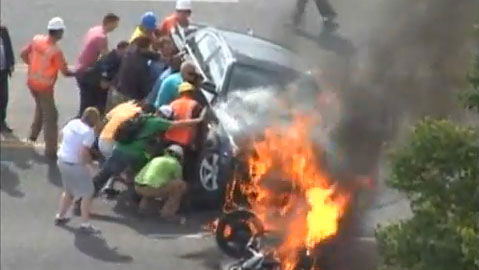 Biker rescued from fiery crash