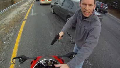 Charges dropped against speeding biker who filmed gun-toting cop during arrest 