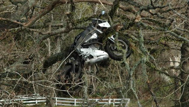 Motorcycle stuck in tree after crash