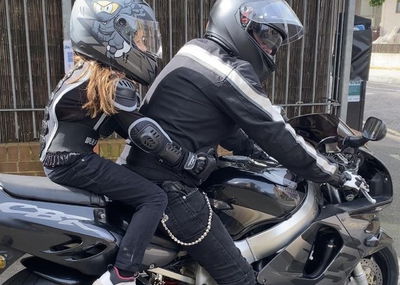 A Honda Fireblade with a young pillion 