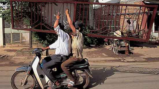 Ladder-carrying biker causes three-car smash