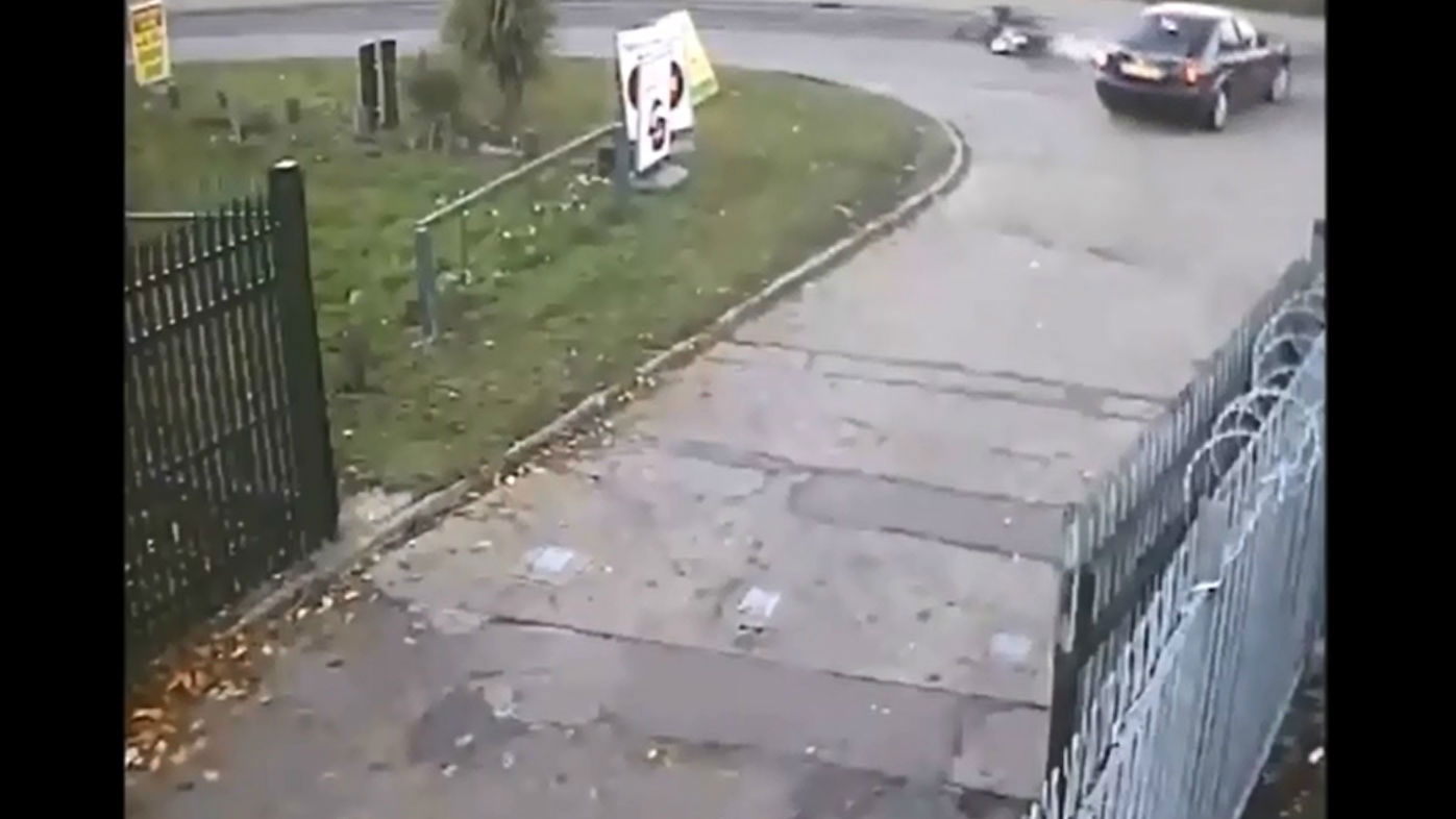 CCTV shows car pull out on motorcyclist then leave crash scene