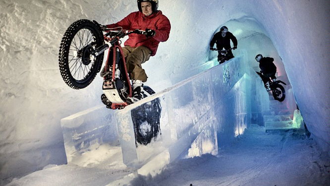 Dougie Lampkin rides through ice hotel on his trials bike