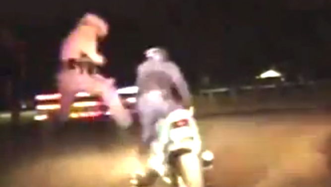 Cop shoots biker then karate kicks him