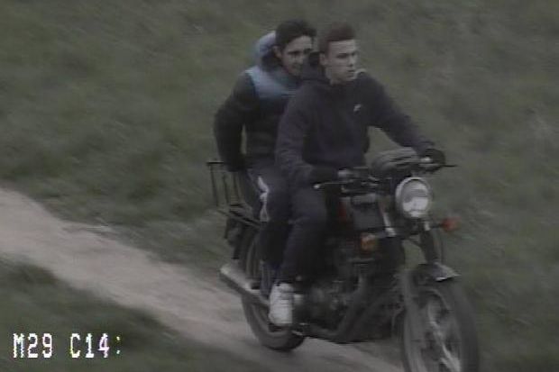 Motorcycle stolen in London as people stand and watch