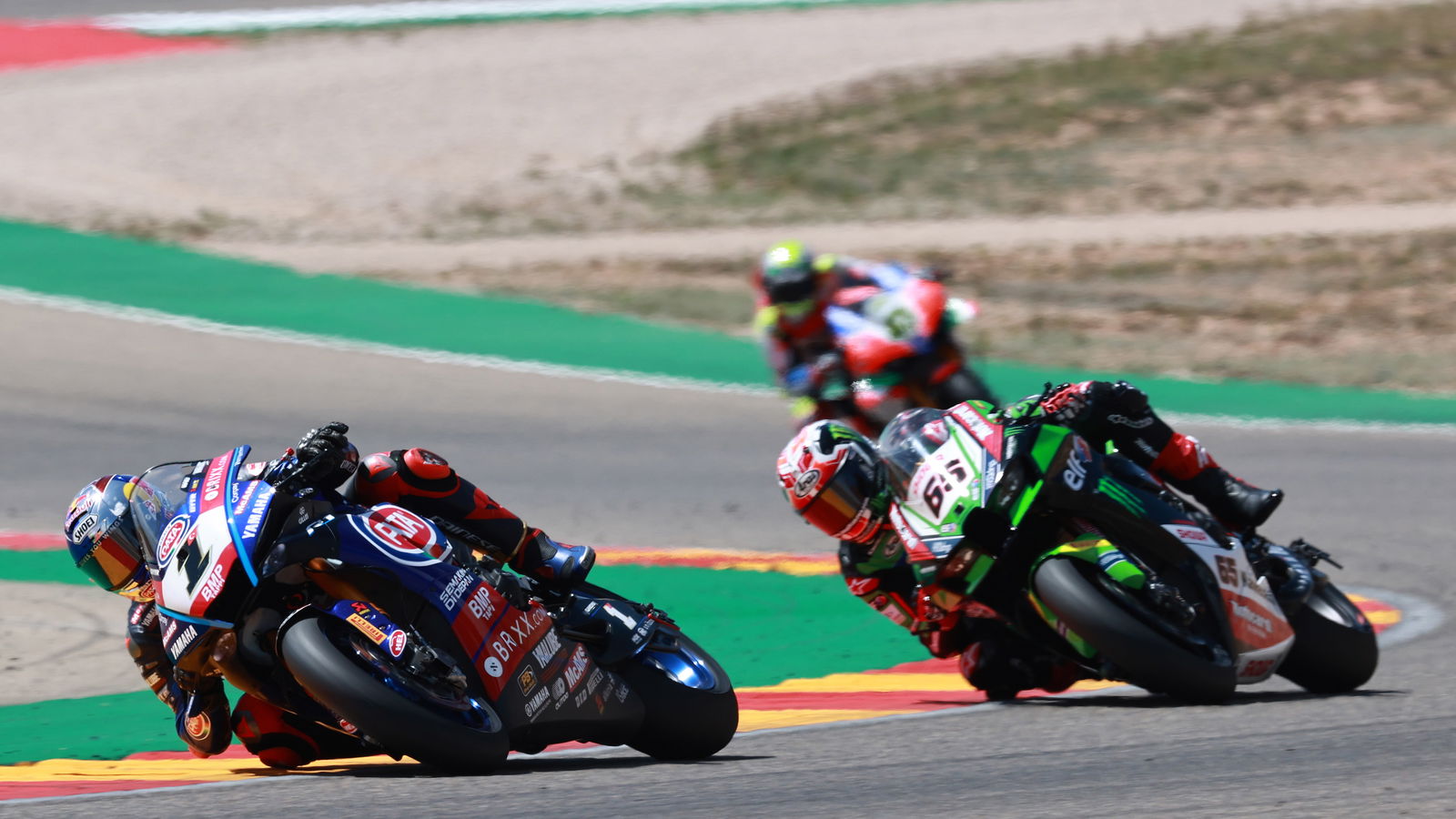 Toprak Razgatlioglu leads Jonathan Rea, 2022 Aragon WorldSBK. - Gold and Goose