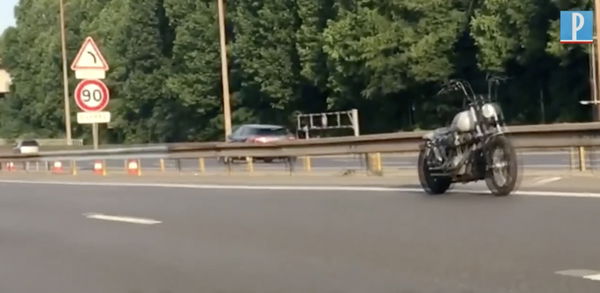 A Harley-Davidson Dana moving along a road without a rider