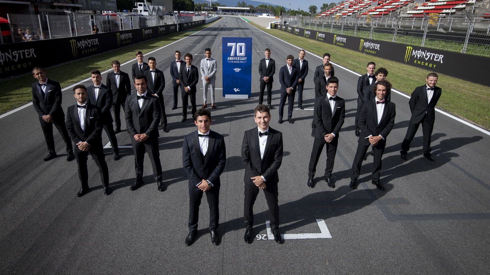 Riders in suits for 70th anniversary of grand prix