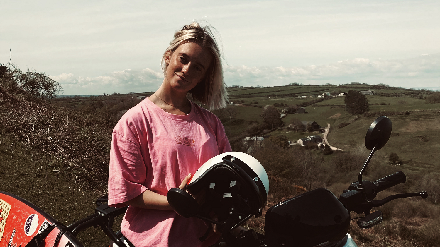 Alys Barton on NIU scooter