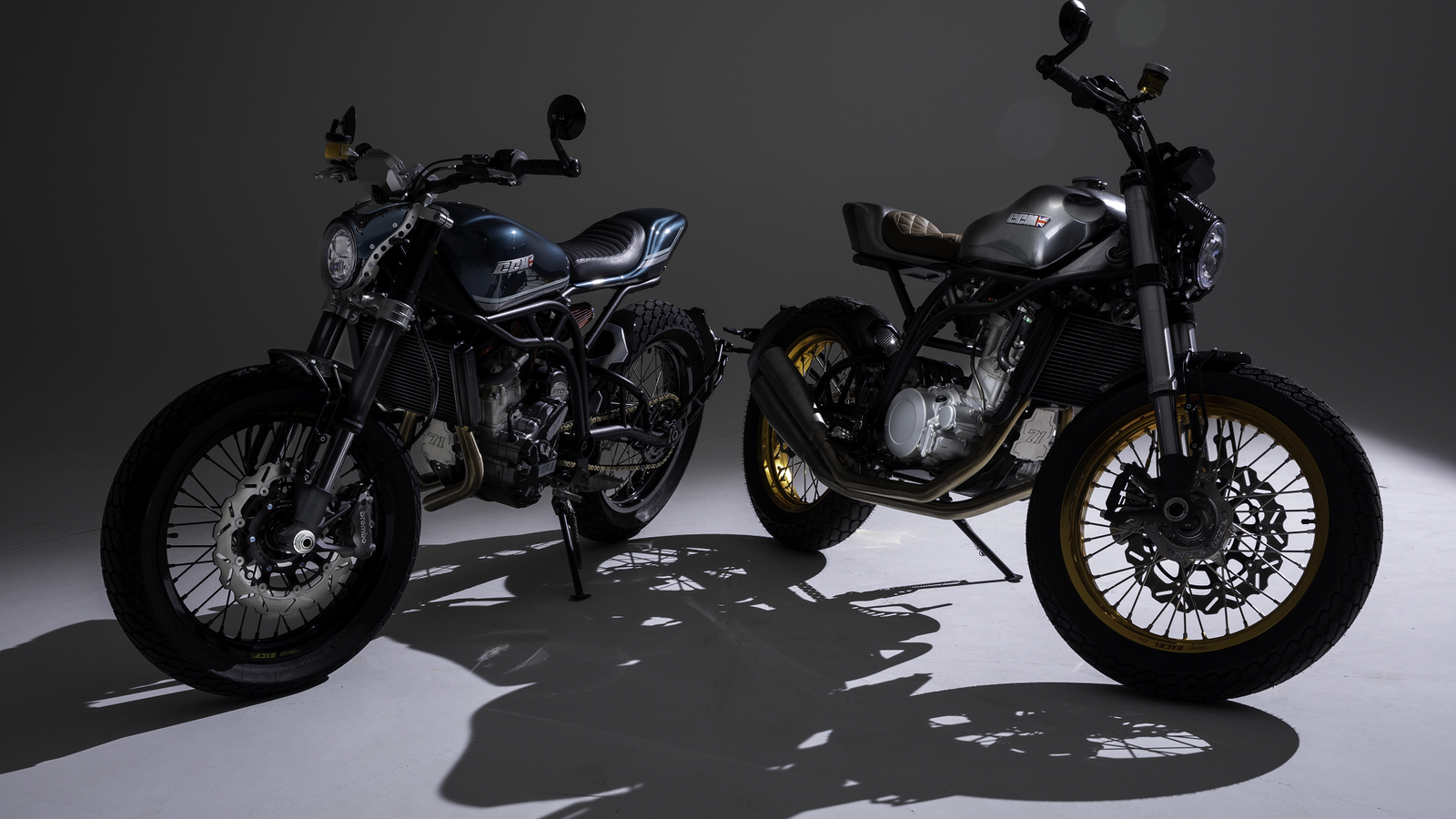 Two CCM Trackers, one in Petrol Blue, one in chrome. - CCM