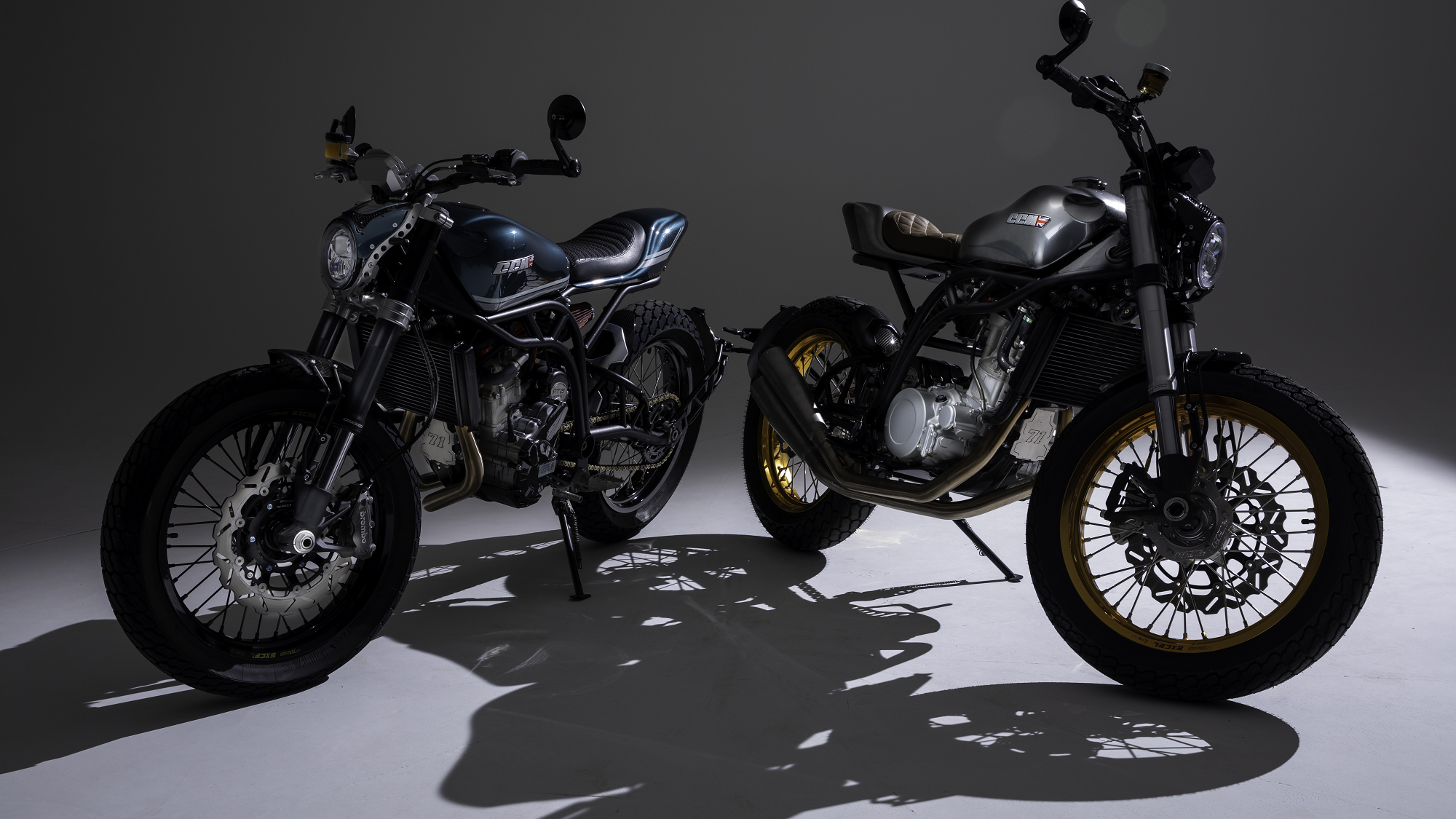 Two CCM Trackers, one in Petrol Blue, one in chrome. - CCM