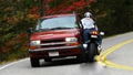 Biker runs wide and strikes car - photo sequence