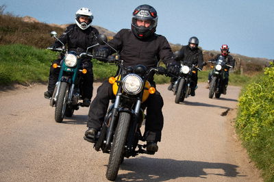 Royal Enfield bikes riding in mini-convoy.