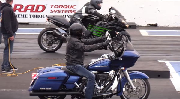 Motorcycle racer hitches a ride on his opponent