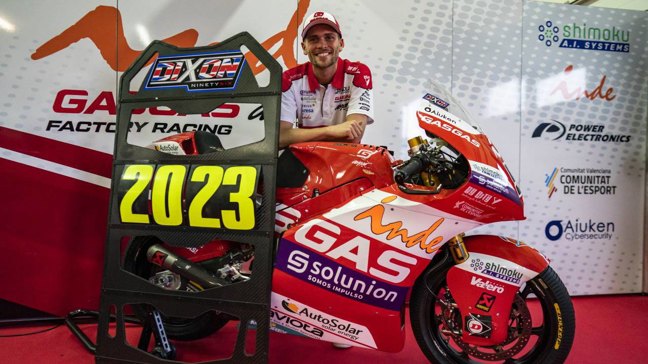 Jake Dixon with pit board with "2023". 