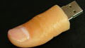 Amputee biker turns false finger into USB drive