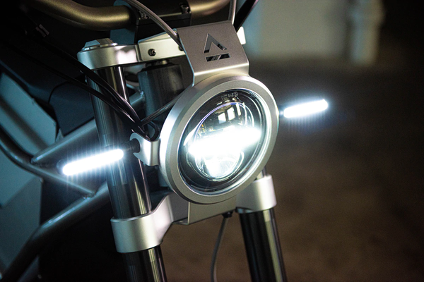 Land Moto District, headlight close-up.