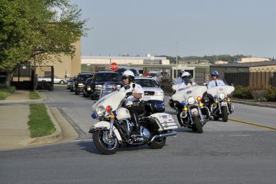 A1C Perry Aston, Public domain, via Wikimedia Commons - A file image of a Police Motorcade